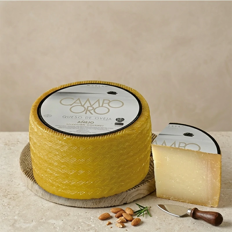 Queso zamorano añejo de oveja Campo Oro curado con textura semidura y color marfil ideal para tablas de queso gourmet.